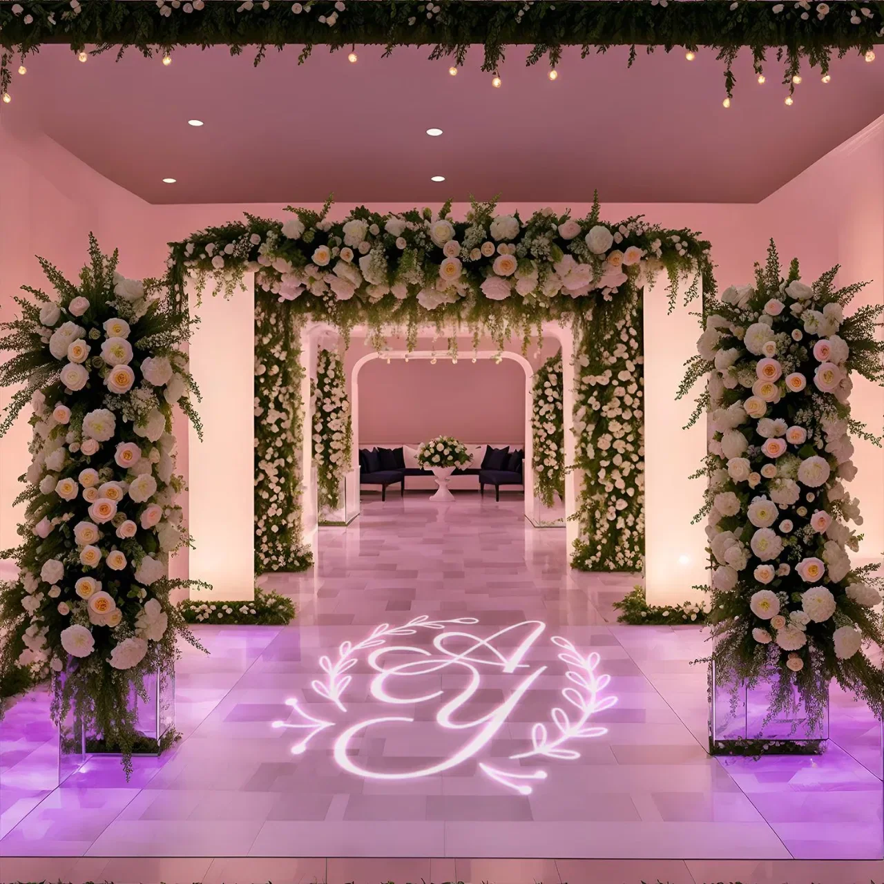 Custom wedding monogram GOBO projection lighting on venue wall for Indian reception